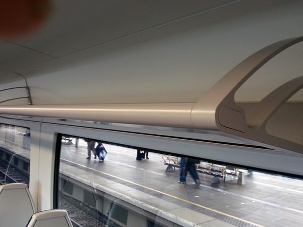 An above-seat rack, space for coats and small bags only.